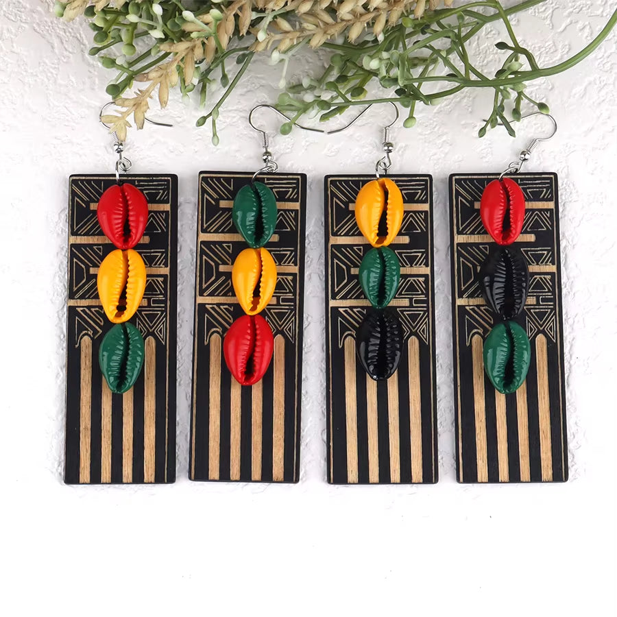 Four pairs of colorful shell earrings on black and gold striped cards with a white background.