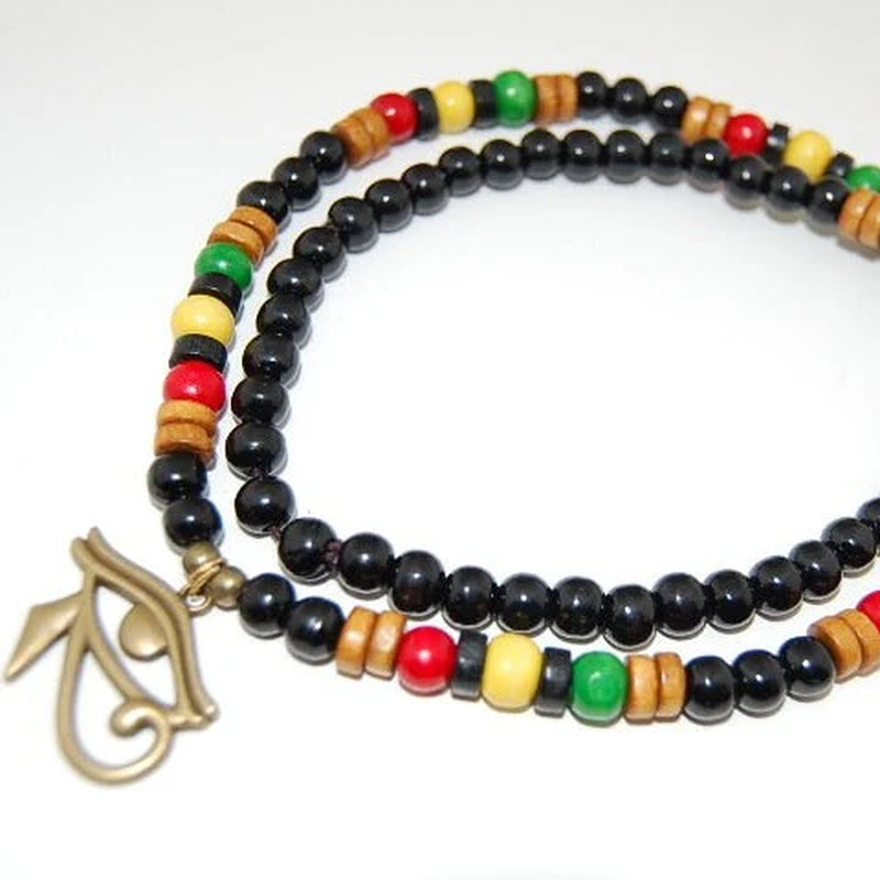 Multicolored beaded bracelet with a gold charm on a white background
