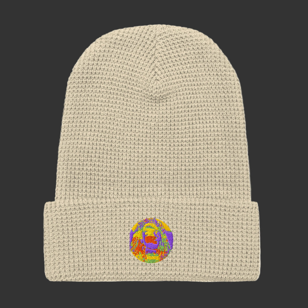 Beige knit beanie with a colorful embroidered logo on a white background